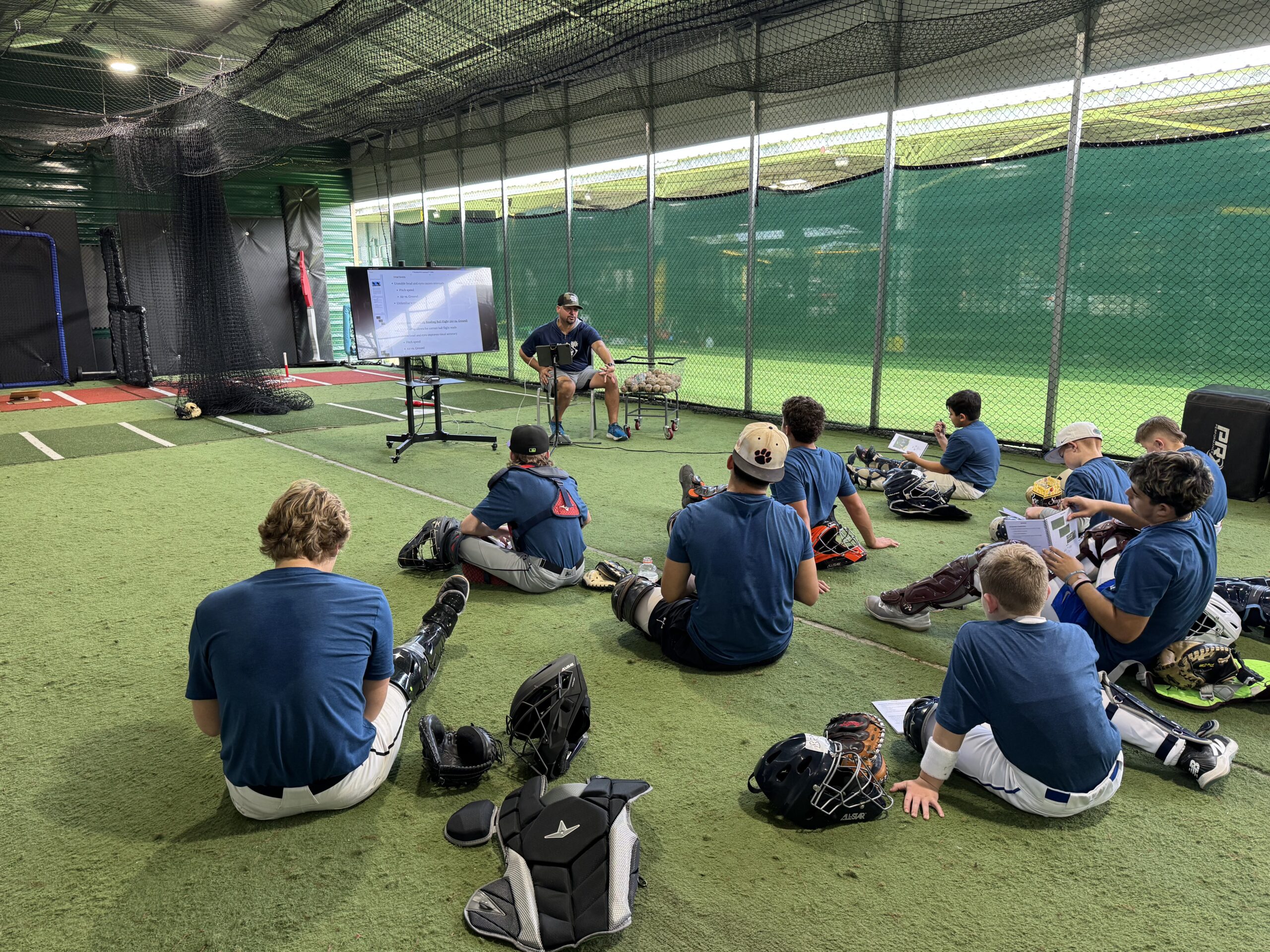 Eddy Rodriguez coaching catchers