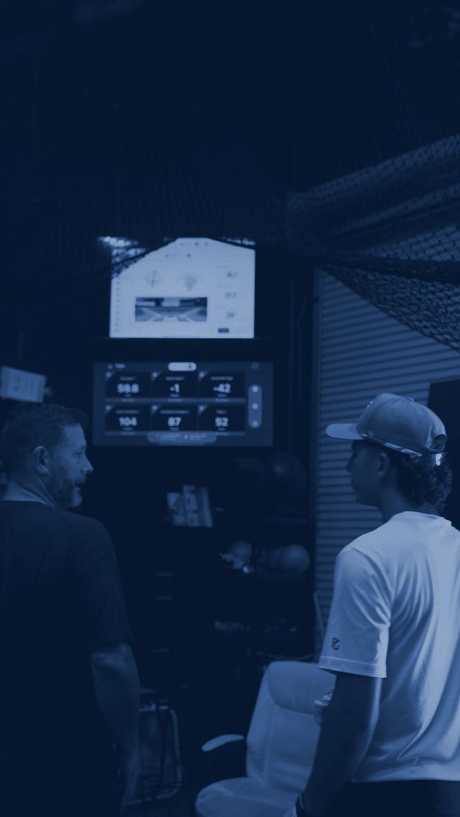 An FBR coach reviewing live data with a hitter