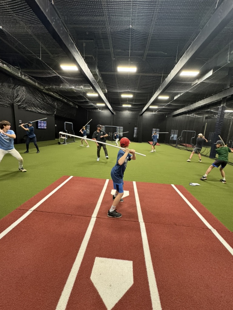 Camp instruction on the floor at the Florida Baseball Ranch