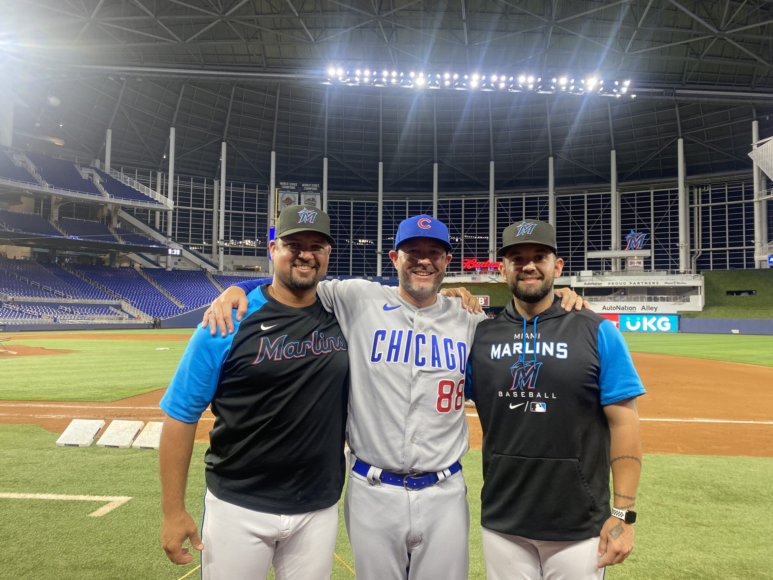 Greg Brown and coaches at the ballpark