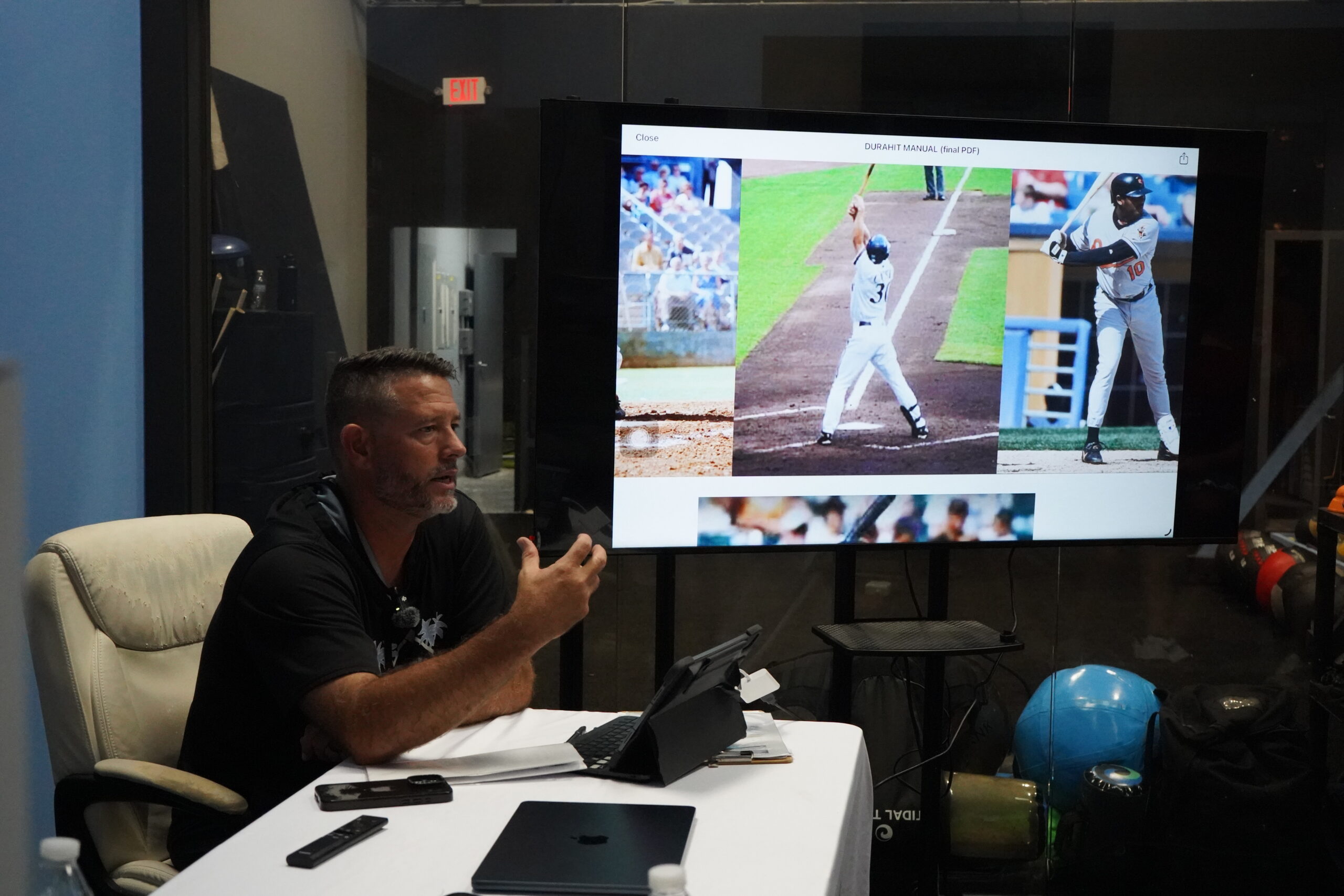 Greg Brown coaching a hitter